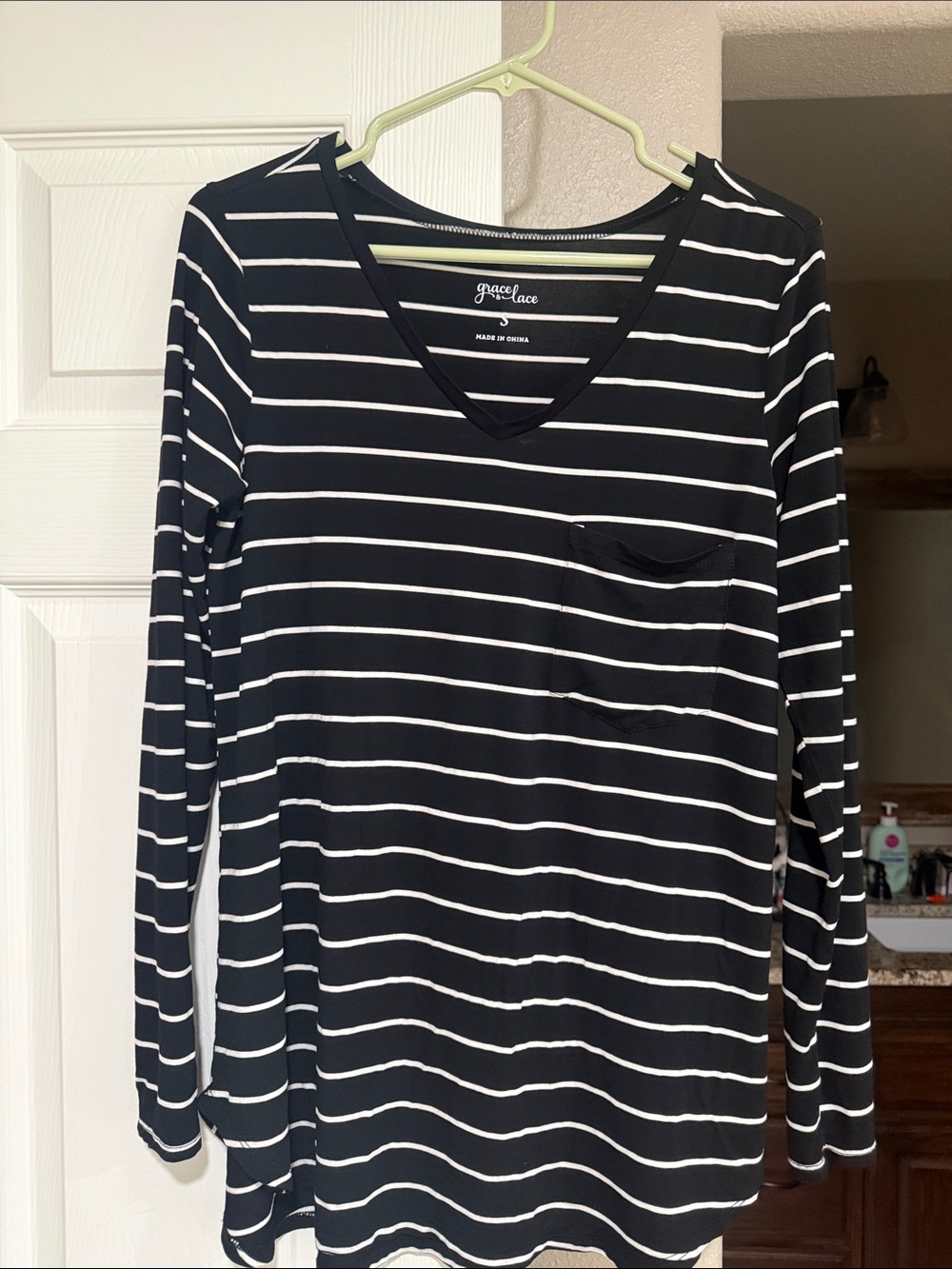Grace & Lace Black and White Striped V‑Neck Pocket Top